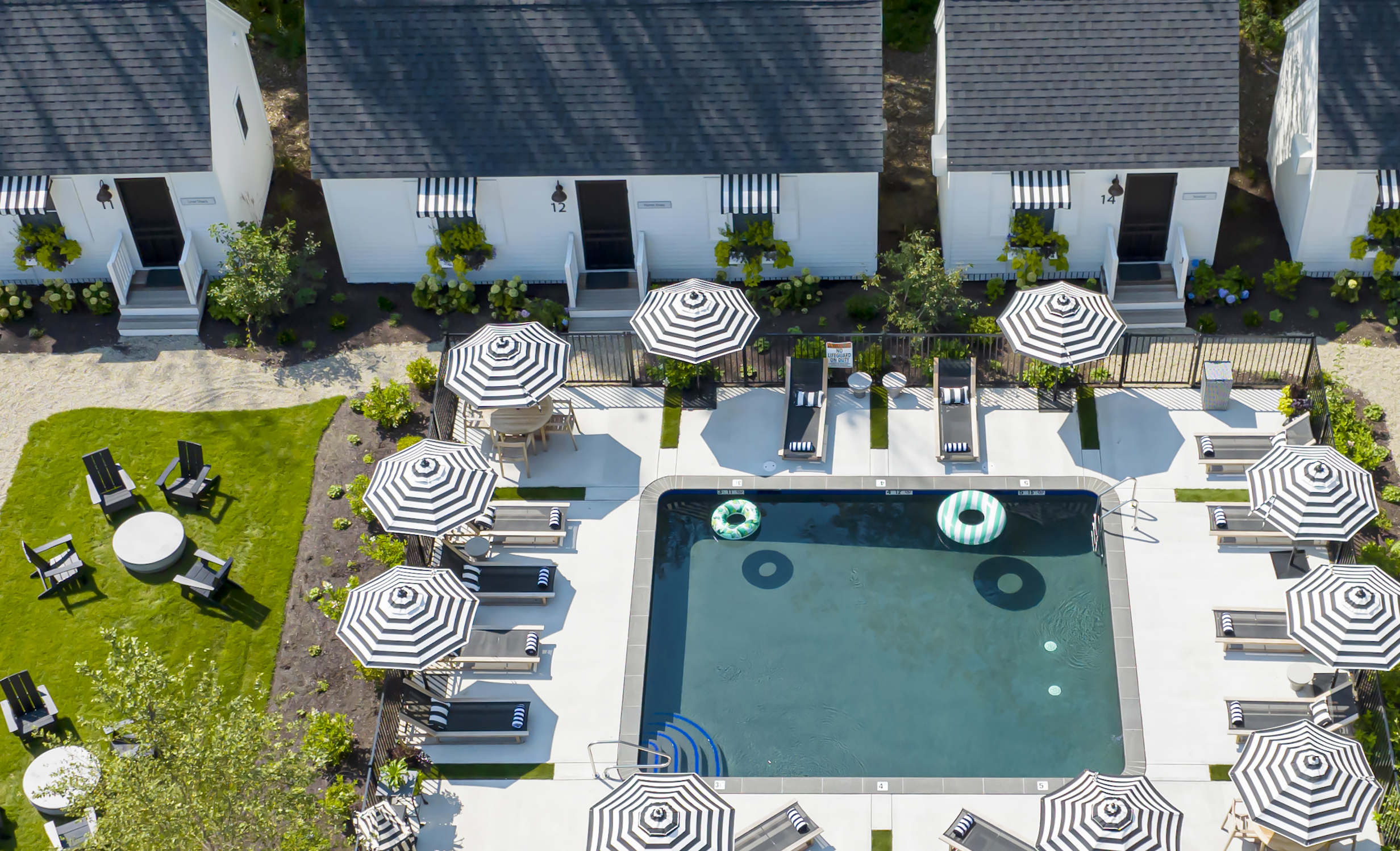 wanderer-pool pool with cottages behind it